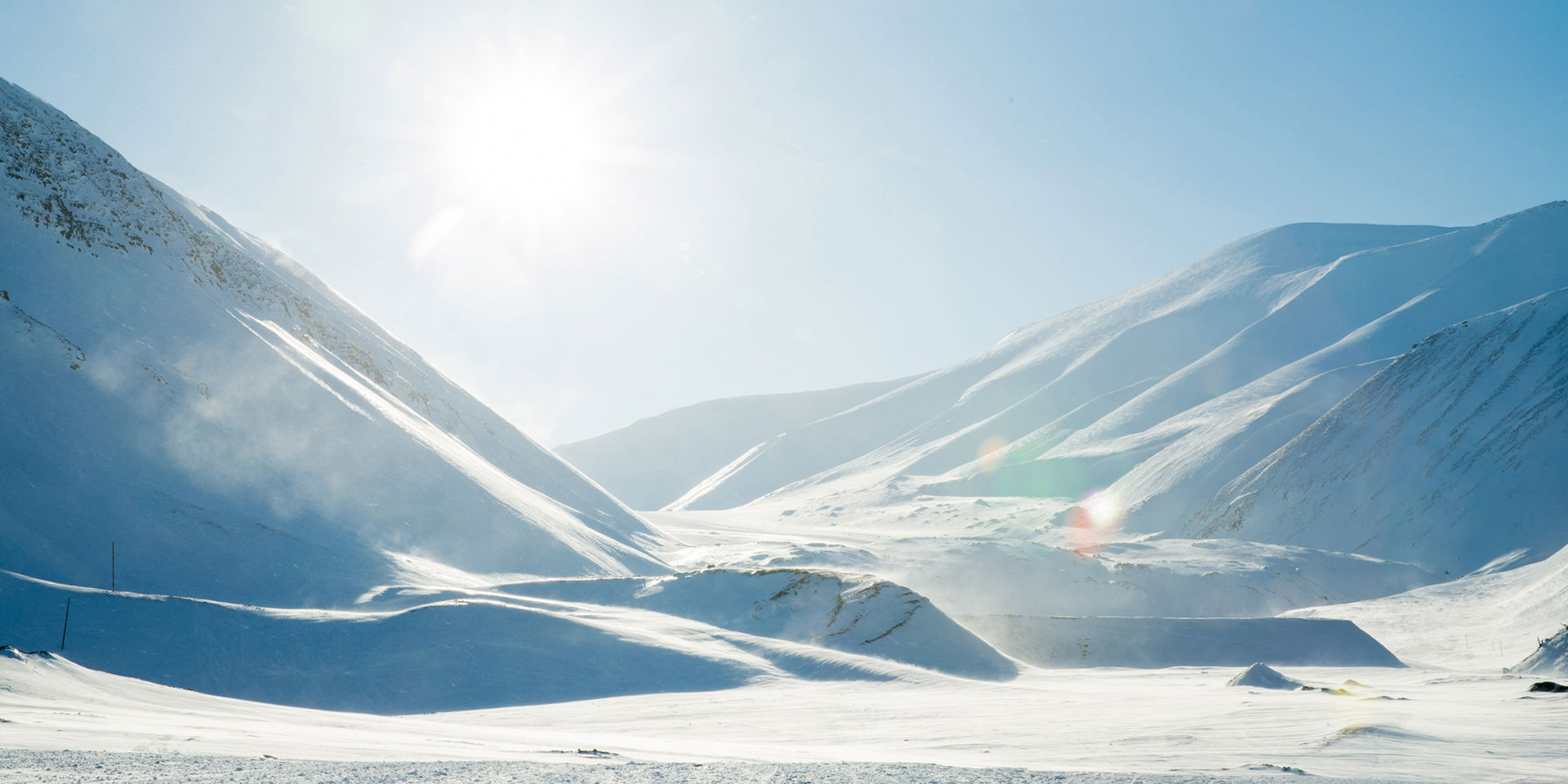 Sol i snølandskap